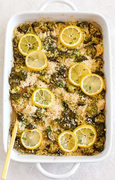 a casserole dish with lemons, broccoli and rice