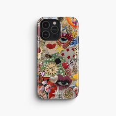 an iphone case with many different things on it, including the face and eyeballs