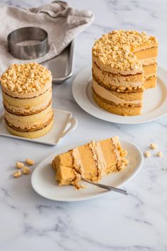 three pieces of cake sitting on plates next to a pan with one slice cut out