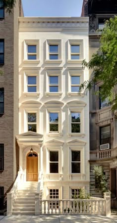 an apartment building with many windows and stairs