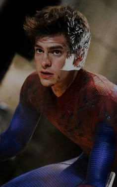 the amazing spider - man looks like he's getting ready to go into action