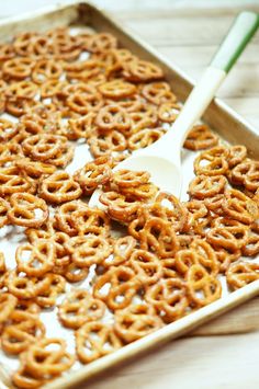 a tray filled with pretzels and a spoon