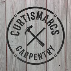 a wooden sign with the words craftsman's carpentry and two crossed hammers