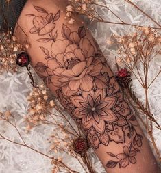 a woman's arm with flowers on it