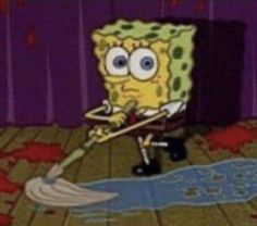 spongebob is cleaning the floor with a mop