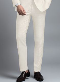 Indulge in the exquisite craftsmanship of these outstanding Loro Piana Bianchi Wool Silk Linen Pants, designed for a man of discerning taste. Meticulously woven from premium wool, silk, and linen, it offers a luxuriously smooth texture with a subtle sheen, ensuring both comfort and elegance. This impeccably tailored pant, featuring a solid pattern and a beige hue, provides versatility and a refined look suitable for various occasions. It effortlessly transitions from professional settings to formal events with seamless elegance.    A marriage of elegance and comfort, Loro Piana fabrics are made using the highest quality raw materials in the world, in their purest form or blended together. A sophisticated response to the dictates of contemporary elegance, these fabrics lend themselves to a Master Tailor, Tailored Suit, Silk Linen, Linen Suit, Formal Suits, Loro Piana, Custom Tailoring, Smooth Texture, Solid Pattern