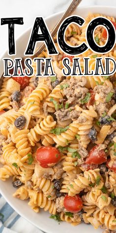 this pasta salad is loaded with meat, tomatoes and olives it's ready to be eaten