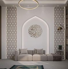 a living room with a couch, rug and arabic style wallpaper on the walls