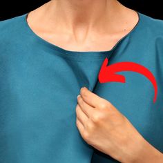 a woman wearing a blue t - shirt with red arrow drawn on it's chest