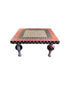 a coffee table with an intricate design on top