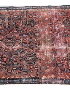 an old rug with many different colors and patterns