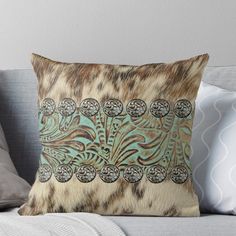 an animal print pillow on a couch