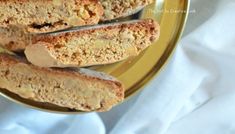 four pieces of bread on a gold plate