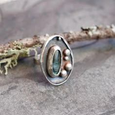 Silver Labradorite Ring. Hand Forged And Set In A Dark Hand Patina Base With A Hand Hammered Band. 925 Sterling. This Stone Helps The Wearer Achieve Success. Inuit Legend Says A Warrior Saw The Stunning Northern Lights Trapped In The Rock And He Freed The Light By Striking It With His Spear. I Agree As It’s Colors Are Mesmerizing. Labradorite It Is Also Said To Be Used To Help Cure What Ails You. This Ring Is Size 7.5. Shipped In A Lovely Box For Safe Keeping. Handmade By Me. #Labradorite #Labra Handmade Spinner Ring, Art Deco Silver Ring, Tube Setting Ring, Ring With Stone Design, Art Deco Engagement Ring Silver, 2 Stone Rings, Metal Smithing Jewelry, Silver Smithing Jewelry, Big Silver Rings