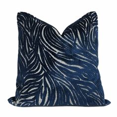 a blue and white zebra print pillow on a white background