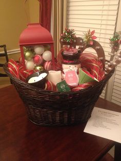 a basket filled with christmas items sitting on top of a table