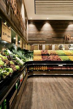 a grocery store filled with lots of fresh fruits and veggies on display next to each other