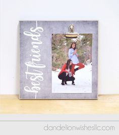 a family picture frame with the word happy new year written on it and an image of two children