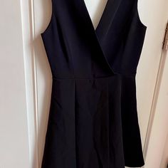 This Black Crepe Dress Has A Beautiful Deep Plunge V-Neck (Designed To Be Open Between Breasts (Closing At End Of Sternum/Top Of Diaphragm) And A V-Back. It Has A Gorgeous Layered Swing Skirt. It Is A Flattering Bodice And Breastbone- It Also Nicely Drapes To Cover And Hide Waist, Below Belly Button. The Weight Of The Skirting Keeps The V Plunge In Place. I Think This Dress Is Timeless As An Lbd A La Audrey Hepburn- I Just Don’t Have A Pretty Lady Place To Go These Days. Chic Black A-line V-neck Dress, Chic Crepe V-neck Dress, Flattering Black V-neck Dress, Black V-neck Dress With Buttons, Black V-neck Dress With Built-in Bra, Black Crepe Dress, Fuschia Dress, Mini Dress Hot, Below The Knee Dresses