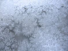 frosty patterns on the surface of an icy window