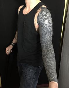 a man with a tattoo on his arm