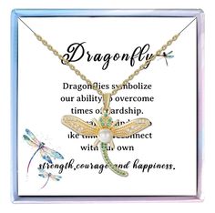 a dragonfly necklace with an inspirational quote on the front and back, in gold