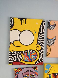 three square paintings with cartoon characters on them, one is yellow and the other is pink