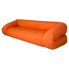 an orange inflatable couch sitting on top of a white floor