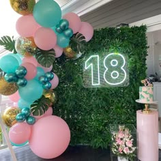 a party with balloons, cake and decorations on the front porch for an 18th birthday