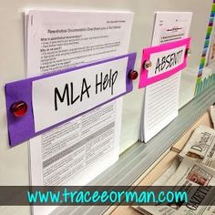 three sticky notes with the words mla help pinned to them on a bulletin board