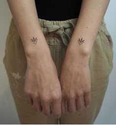 two small tattoos on both hands