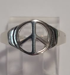 These rings are old store stock- unworn. It is top quality sterling silver. The peace sign is 3/8 of an inch around. This retailed at $36. It comes in a tiny ring box. Hippy Rings, Indie Rings, Peace Sign Ring, Peace Sign Jewelry, Peace Ring, Funky Rings, Hippie Rings, Tiny Rings, Funky Jewelry