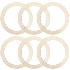 four white gasket rings on a white background