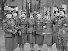 a group of women in uniform posing for a photo