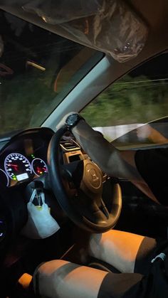 the interior of a car with dashboard lights and gauges