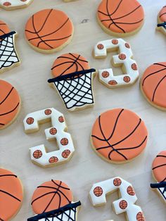 decorated cookies with basketballs and hoop on them are arranged in the shape of numbers