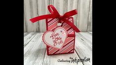 a valentine's day gift box with a heart tag