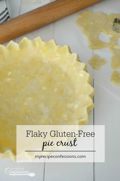 flaky gluten - free pie crust in a pie pan on a white table