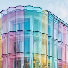 a multicolored building is shown against a blue sky