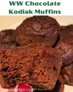 chocolate kodiak muffins on a plate with cherries