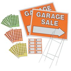 an orange garage sale sign next to several stickers on a white background with the words garage sale written below it