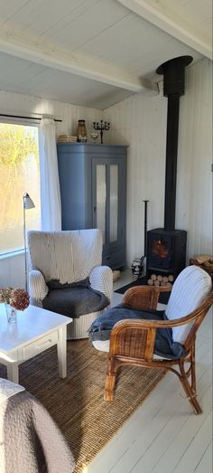 a living room filled with furniture and a fire place