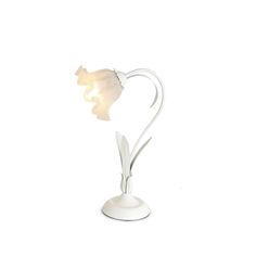 a white vase with a flower in the shape of a heart