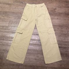 Cargo Pants Brand: Shein Size: M Style: Cargo Color: Beige Condition: Never Worn Full Length Beige Bottoms With Pockets, High Waist Beige Pants With Pockets, Beige Full Length Bottoms With Pockets, Summer Work Pants With Pockets, Cheap Beige Mid-rise Bottoms, Casual Beige Mid-rise Wide Leg Pants, Mid-rise Beige Pants With Side Pockets, Beige Full-length Bottoms With Pockets, Black Leather Jeans