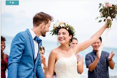 a bride and groom walking down the aisle after their wedding ceremony at the beach in hawaii