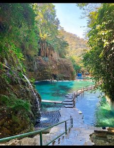 the water is blue and green with steps leading up to it