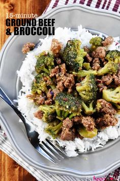 beef and broccoli on rice in a bowl with a fork next to it