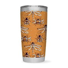 an orange tumbler cup with bees on it