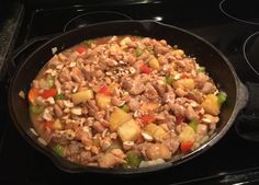 a pan filled with food sitting on top of a stove