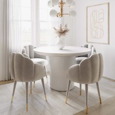 a dining room table with chairs around it